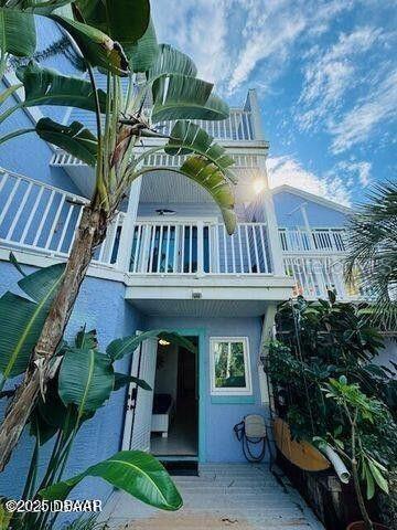 3000 Ocean Shore Blvd Unit 150, Ormond Beach, FL 32176 - rear view of house featuring a balcony