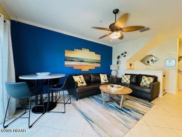 3000 Ocean Shore Blvd Unit 150, Ormond Beach, FL 32176 - living area featuring crown molding, visible vents, tile patterned flooring, and ceiling fan