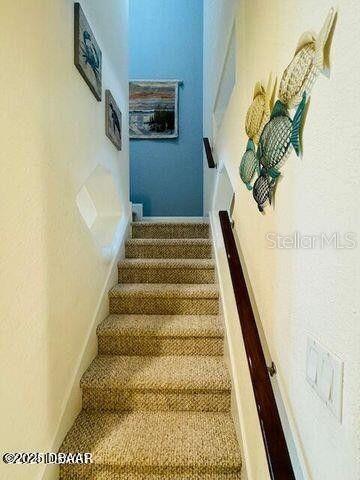 3000 Ocean Shore Blvd Unit 150, Ormond Beach, FL 32176 - stairs with carpet