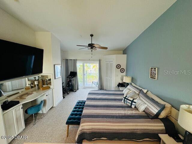 3000 Ocean Shore Blvd Unit 150, Ormond Beach, FL 32176 - bedroom with ceiling fan, light colored carpet, and access to exterior