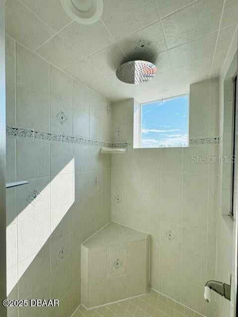 3000 Ocean Shore Blvd Unit 150, Ormond Beach, FL 32176 - full bathroom featuring tiled shower