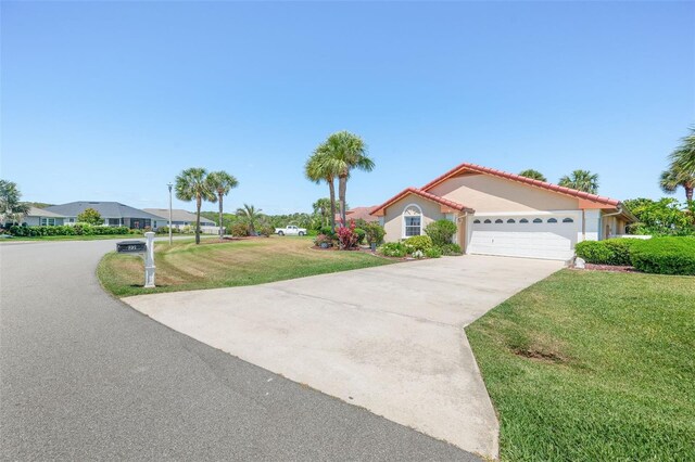 22 San Carlos Dr, Palm Coast, FL 32137 - view of front of property featuring driveway, a front lawn, a garage, a tile roof, and stucco siding