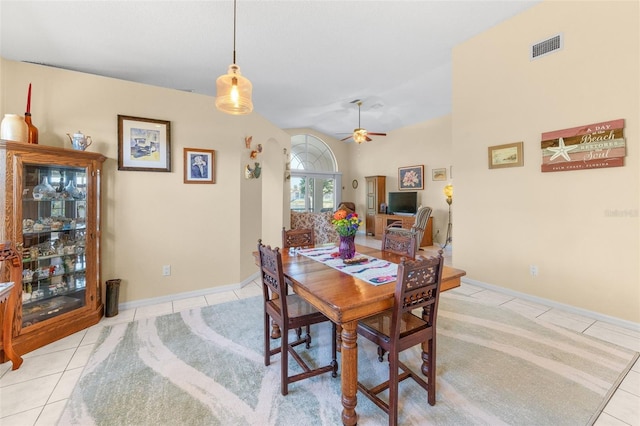 22 San Carlos Dr, Palm Coast, FL 32137 - dining area featuring light tile patterned floors, a ceiling fan, and baseboards