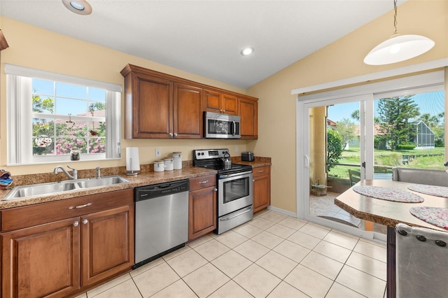 22 San Carlos Dr, Palm Coast, FL 32137 - kitchen with stainless steel appliances, a sink, lofted ceiling, plenty of natural light, and recessed lighting