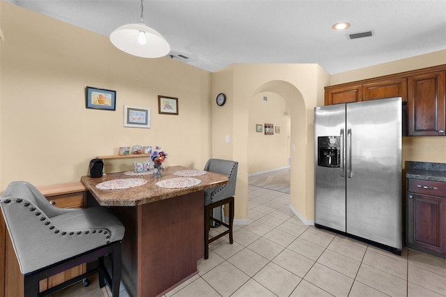 22 San Carlos Dr, Palm Coast, FL 32137 - dining area featuring arched walkways, light tile patterned floors, and recessed lighting