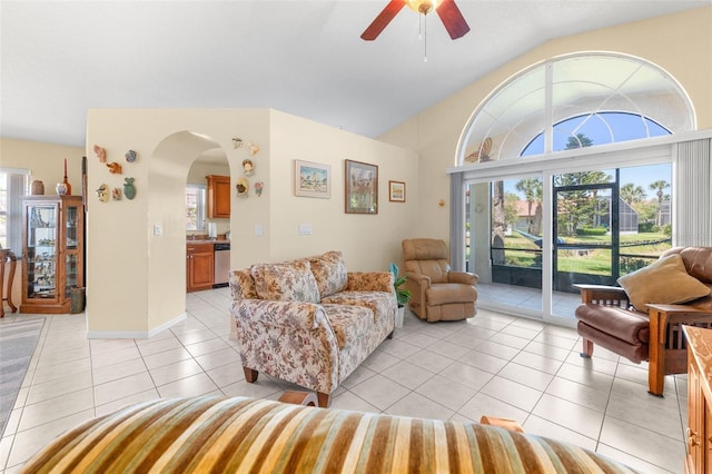 22 San Carlos Dr, Palm Coast, FL 32137 - living room with lofted ceiling, arched walkways, a ceiling fan, and light tile patterned floors