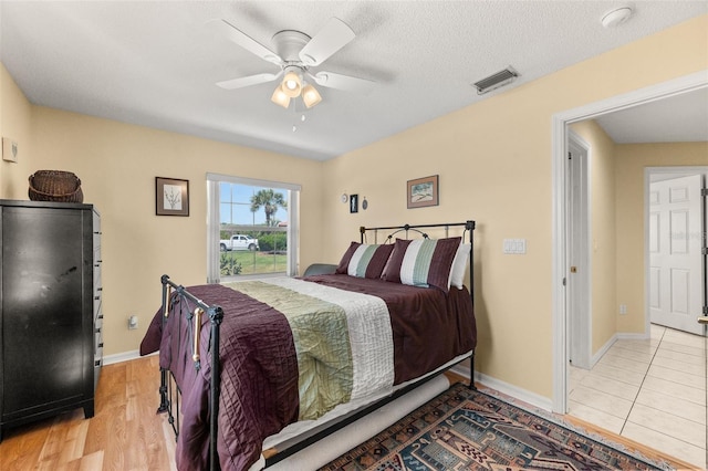 22 San Carlos Dr, Palm Coast, FL 32137 - bedroom featuring baseboards, ceiling fan, and light wood-style flooring