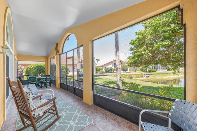 22 San Carlos Dr, Palm Coast, FL 32137 - sunroom / solarium featuring vaulted ceiling, a water view, and tile patterned floors