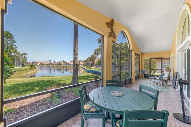 22 San Carlos Dr, Palm Coast, FL 32137 - sunroom featuring a water view, vaulted ceiling, and a residential view