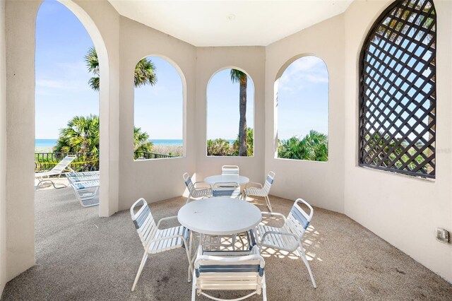 22 San Carlos Dr, Palm Coast, FL 32137 - view of patio featuring a water view and outdoor dining area