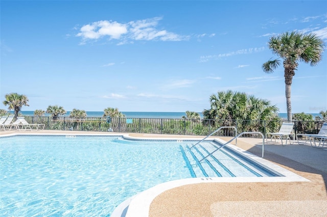 22 San Carlos Dr, Palm Coast, FL 32137 - community pool with fence, a water view, and a patio