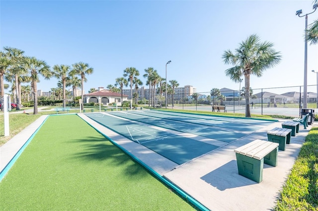 22 San Carlos Dr, Palm Coast, FL 32137 - surrounding community featuring fence, shuffleboard, a bocce ball area, and a tennis court