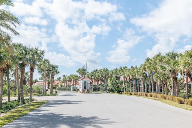 22 San Carlos Dr, Palm Coast, FL 32137 - view of asphalt street featuring street lights and a gated entry