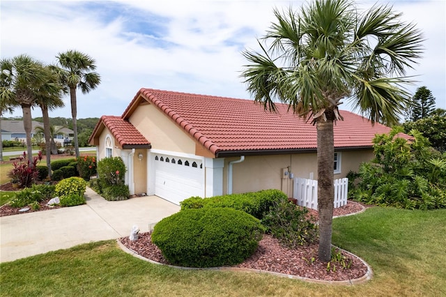 22 San Carlos Dr, Palm Coast, FL 32137 - view of front of property with stucco siding, a garage, a front lawn, driveway, and a tile roof