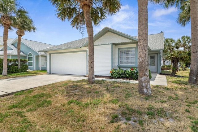 50 Nantucket Dr, Palm Coast, FL 32137 - view of front of house with driveway, a garage, a shingled roof, and a front yard