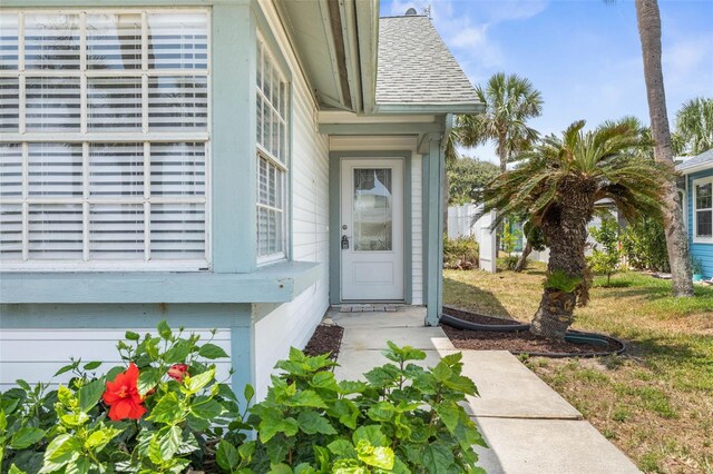50 Nantucket Dr, Palm Coast, FL 32137 - property entrance with a shingled roof