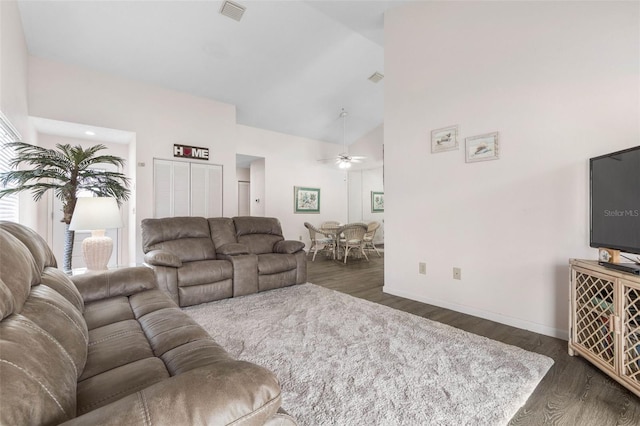 50 Nantucket Dr, Palm Coast, FL 32137 - living area featuring dark wood-type flooring, ceiling fan, high vaulted ceiling, and baseboards