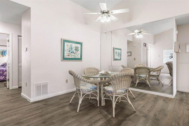50 Nantucket Dr, Palm Coast, FL 32137 - dining area with a ceiling fan, wood finished floors, baseboards, and high vaulted ceiling