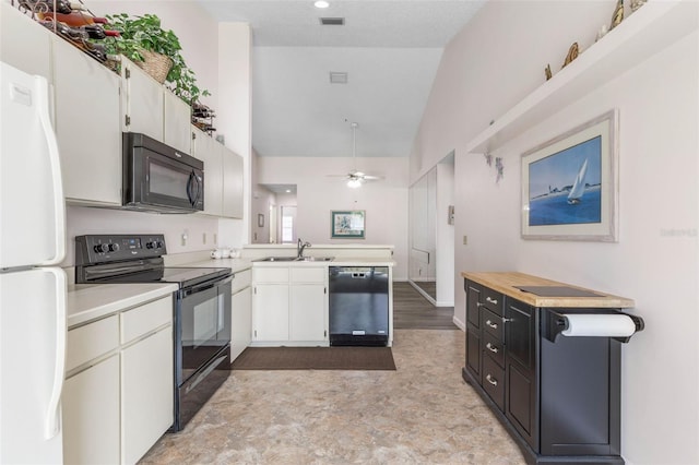 50 Nantucket Dr, Palm Coast, FL 32137 - kitchen with black appliances, light countertops, a sink, a ceiling fan, and a peninsula