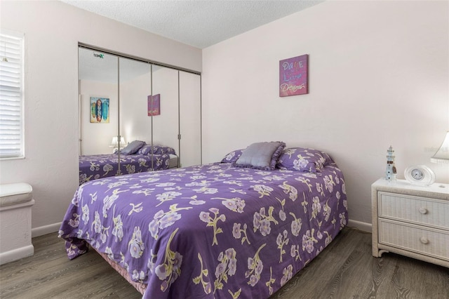 50 Nantucket Dr, Palm Coast, FL 32137 - bedroom with wood finished floors, a closet, and baseboards