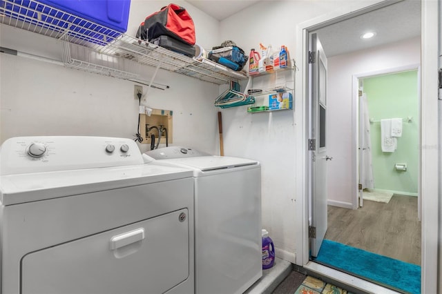 50 Nantucket Dr, Palm Coast, FL 32137 - washroom featuring wood finished floors, separate washer and dryer, and baseboards