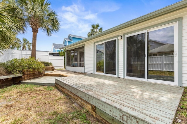50 Nantucket Dr, Palm Coast, FL 32137 - back of house with a wooden deck, fence, and a sunroom