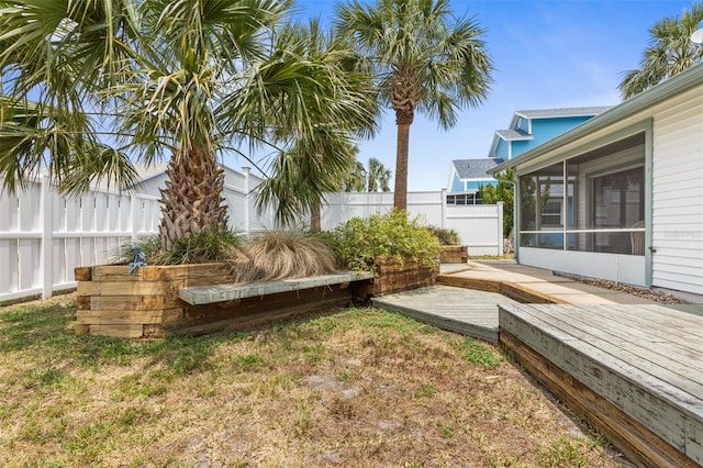 50 Nantucket Dr, Palm Coast, FL 32137 - view of yard with a deck, a sunroom, and fence