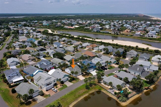 50 Nantucket Dr, Palm Coast, FL 32137 - aerial view of property and surrounding area with nearby suburban area and a large body of water