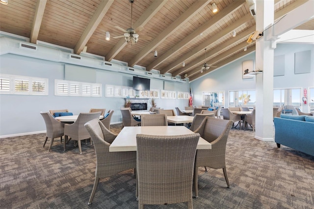 50 Nantucket Dr, Palm Coast, FL 32137 - carpeted dining area featuring ceiling fan, wood ceiling, high vaulted ceiling, baseboards, and beamed ceiling