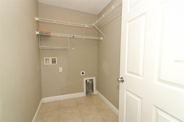 laundry area featuring laundry area, electric dryer hookup, baseboards, and hookup for a washing machine