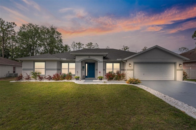 26 White Feather Ln, Palm Coast, FL 32164 - single story home featuring stucco siding, driveway, a front lawn, a garage, and roof with shingles
