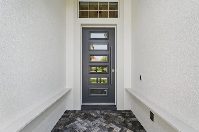 17 Kingfisher Ln, Palm Coast, FL 32137 - doorway to property featuring stucco siding