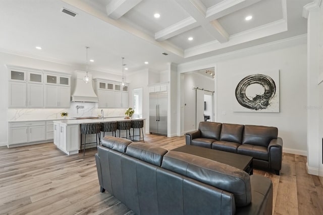 17 Kingfisher Ln, Palm Coast, FL 32137 - living room with beam ceiling, light wood finished floors, coffered ceiling, recessed lighting, and crown molding