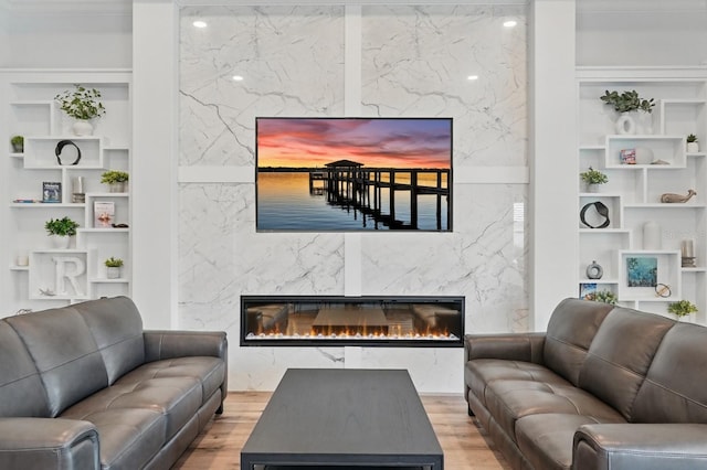 17 Kingfisher Ln, Palm Coast, FL 32137 - living room with a premium fireplace, built in shelves, and wood finished floors