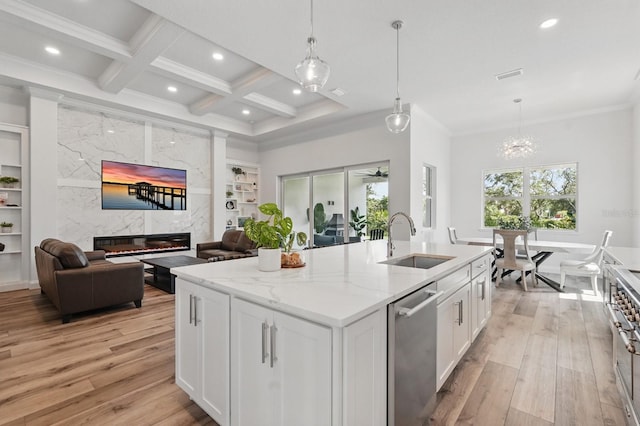 17 Kingfisher Ln, Palm Coast, FL 32137 - kitchen featuring a sink, open floor plan, dishwasher, light wood-style floors, and recessed lighting