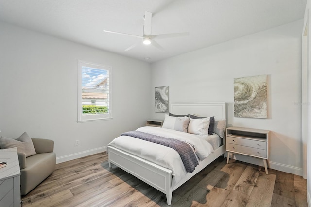 17 Kingfisher Ln, Palm Coast, FL 32137 - bedroom with wood finished floors, baseboards, and a ceiling fan