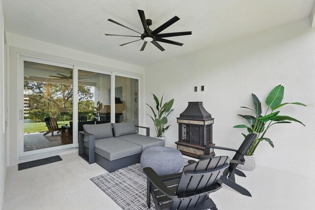 17 Kingfisher Ln, Palm Coast, FL 32137 - view of patio / terrace featuring ceiling fan and an outdoor living space with a fireplace