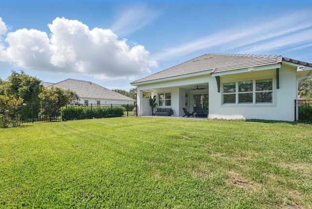 17 Kingfisher Ln, Palm Coast, FL 32137 - rear view of property with ceiling fan, stucco siding, a patio area, and an outdoor hangout area