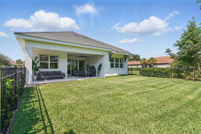 17 Kingfisher Ln, Palm Coast, FL 32137 - back of house with a ceiling fan, stucco siding, a tile roof, and a patio area