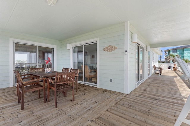 6973 N Oceanshore Blvd, Palm Coast, FL 32137 - deck with outdoor dining area