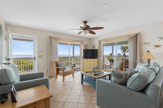6973 N Oceanshore Blvd, Palm Coast, FL 32137 - living area with ceiling fan and light tile patterned flooring