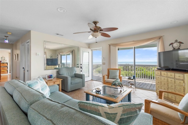 6973 N Oceanshore Blvd, Palm Coast, FL 32137 - living room with light tile patterned flooring and a ceiling fan