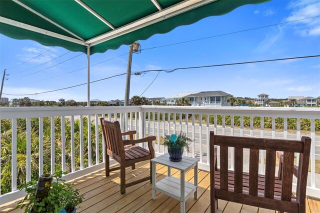 6973 N Oceanshore Blvd, Palm Coast, FL 32137 - wooden terrace with a residential view