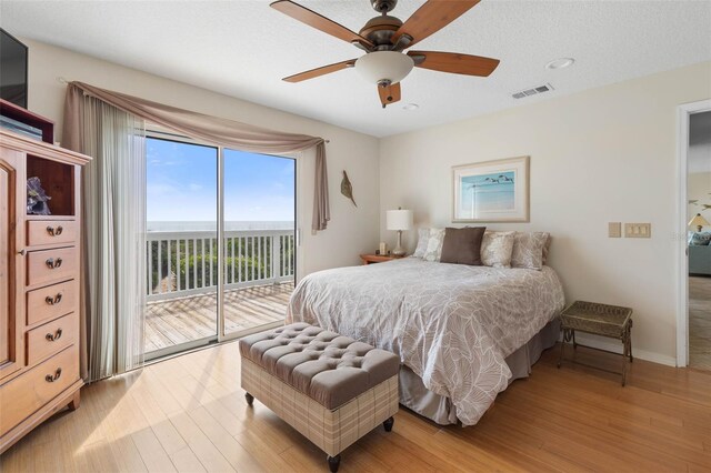6973 N Oceanshore Blvd, Palm Coast, FL 32137 - bedroom featuring access to outside, wood finished floors, baseboards, ceiling fan, and recessed lighting