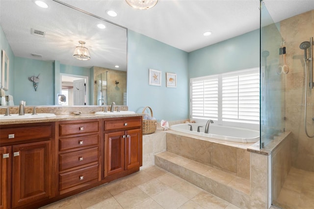 6973 N Oceanshore Blvd, Palm Coast, FL 32137 - bathroom featuring tiled shower, a bath, double vanity, tile patterned flooring, and recessed lighting
