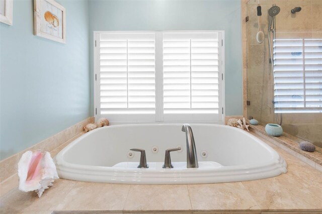 6973 N Oceanshore Blvd, Palm Coast, FL 32137 - bathroom with a tub with jets