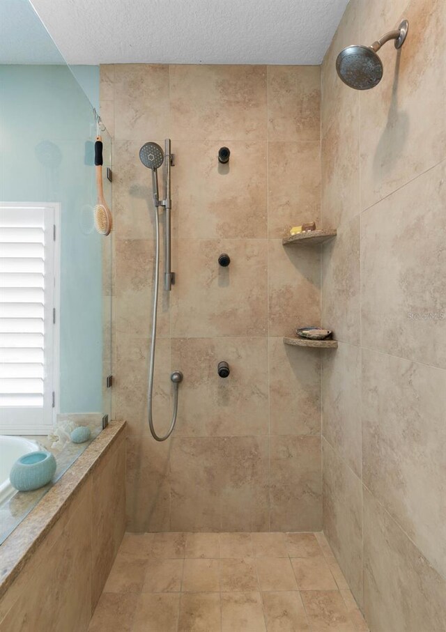6973 N Oceanshore Blvd, Palm Coast, FL 32137 - full bath with tiled shower, a bath, and a textured ceiling