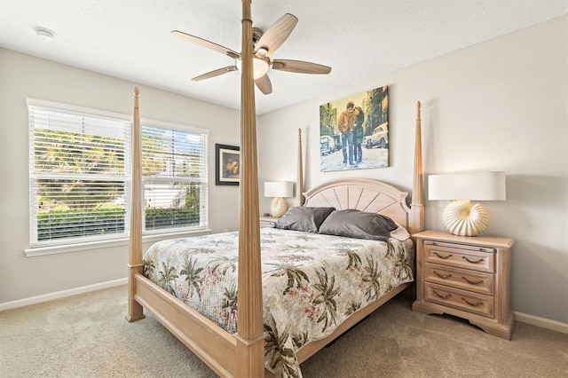 bedroom with light carpet, baseboards, and ceiling fan