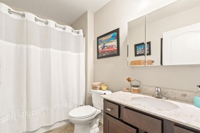 bathroom featuring toilet, vanity, a textured ceiling, and a shower with curtain