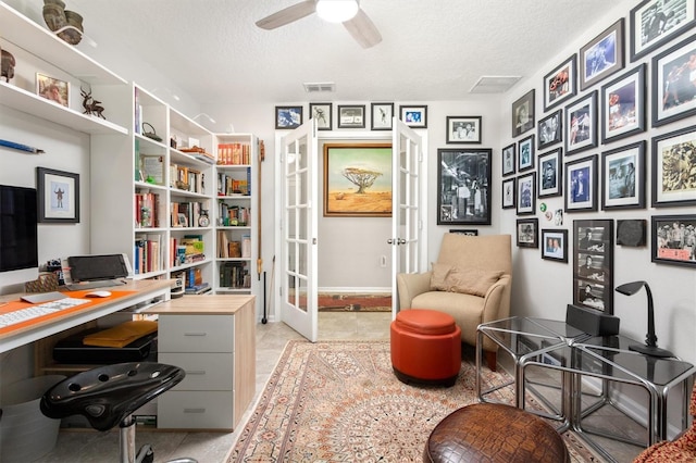 office area featuring french doors, a textured ceiling, a ceiling fan, baseboards, and light tile patterned floors